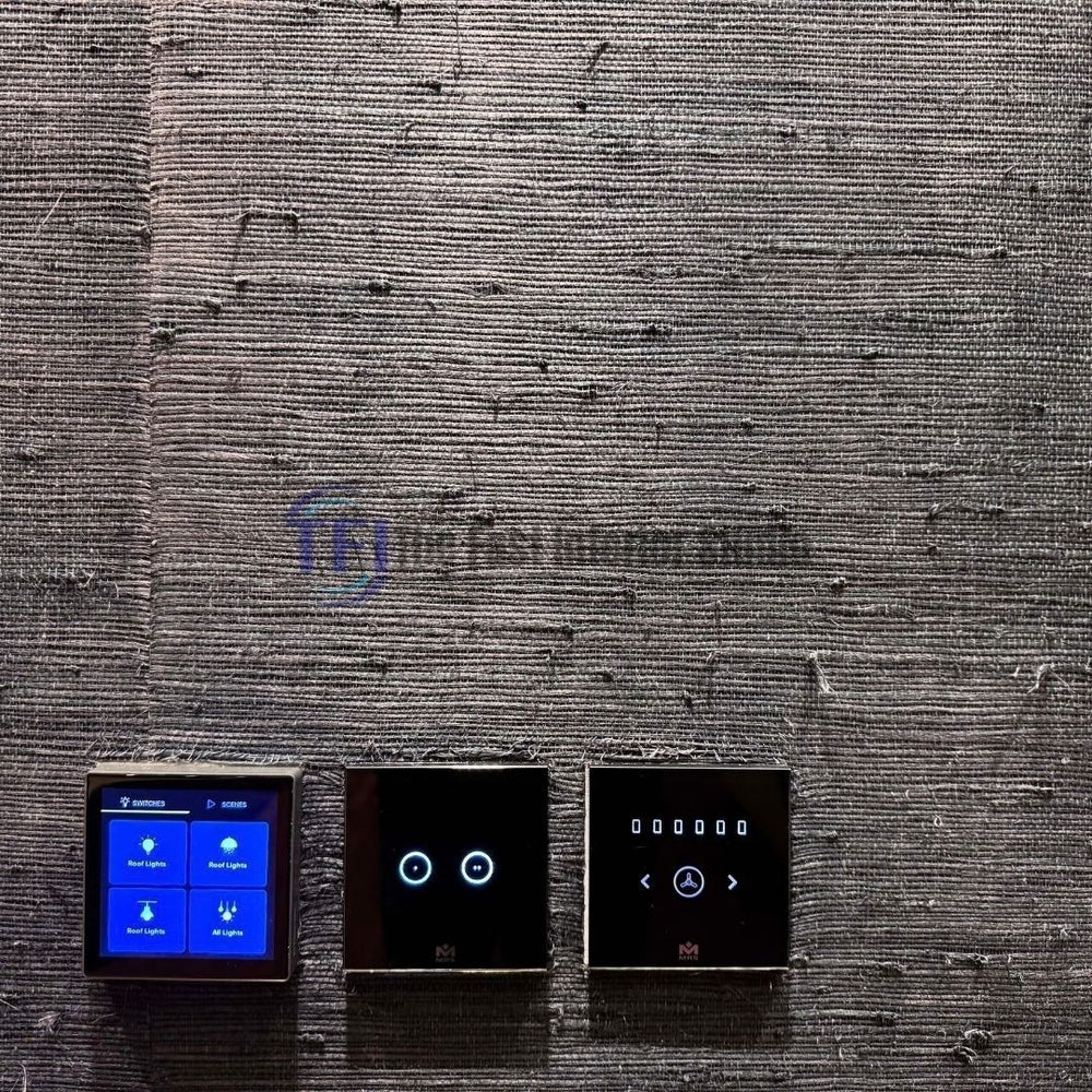 A close-up interior shot of a dark charcoal jute wallpaper accent wall featuring installed smart home automation touch control switches and lighting panels
