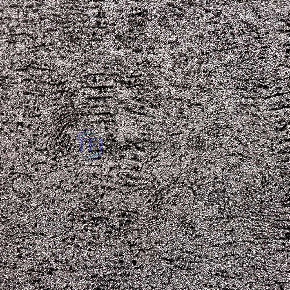 A close-up macro shot showcasing the intricate, embossed metallic and distressed pattern of a modern textured wall covering