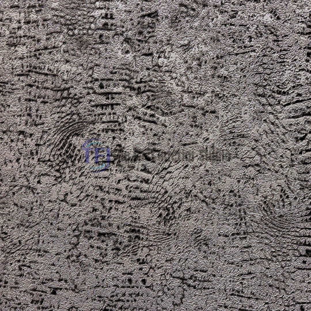 A close-up macro shot showcasing the intricate, embossed metallic and distressed pattern of a modern textured wall covering