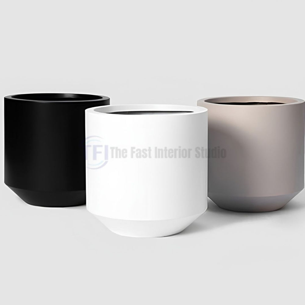 A collection of three modern cylindrical plant pots featuring a beveled base, available in matte black, crisp white, and muted taupe for luxury indoor botanical decor