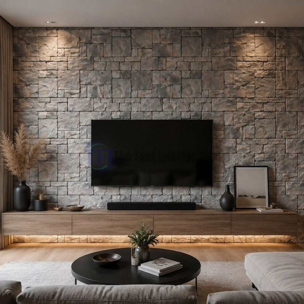 A contemporary TV media wall cladded in 3D PU stacked faux stone panels, beautifully illuminated by warm ceiling downlights over a sleek wooden floating console