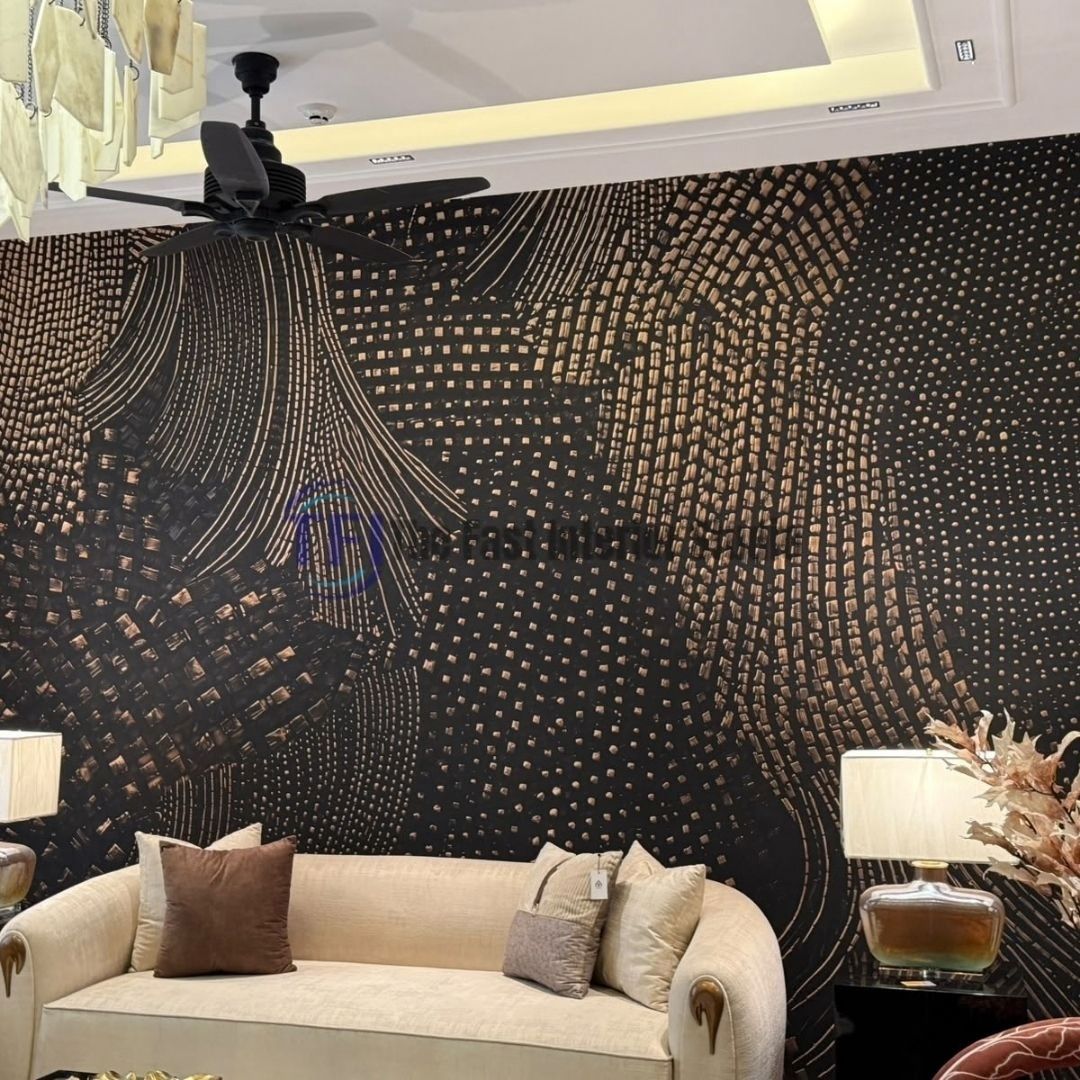 A glamorous living room showcasing a dark abstract mural wallpaper with striking metallic geometric patterns, serving as a dramatic backdrop for a cream sofa