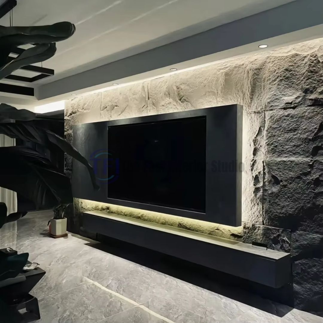 A luxury modern living room featuring a light grey 3D PU chiseled rock feature wall serving as a TV media backdrop, beautifully enhanced by warm LED backlighting behind a black floating console