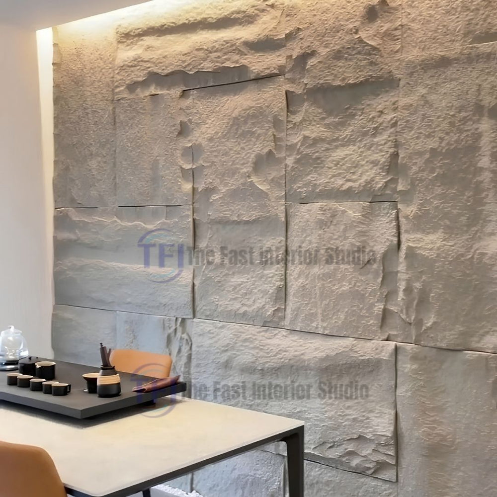 A modern dining or meeting space highlighted by an elegant light grey 3D PU large block faux stone accent wall