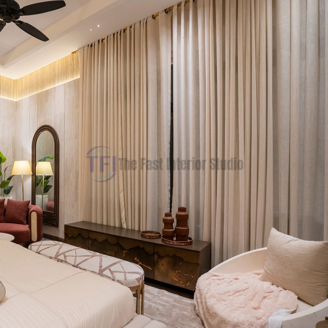 Close-up of pleated beige bedroom curtains under ceiling track lights