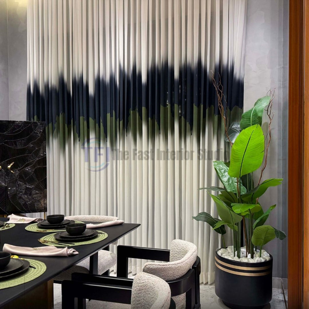 Close-up of pleated white curtains with a dark abstract stripe next to an indoor potted plant