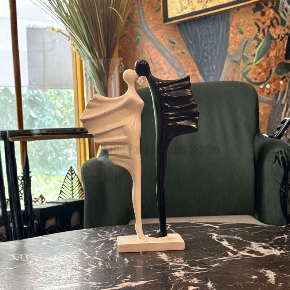 Close up of a premium romantic monochrome intertwined figure statue styled as versatile home decor