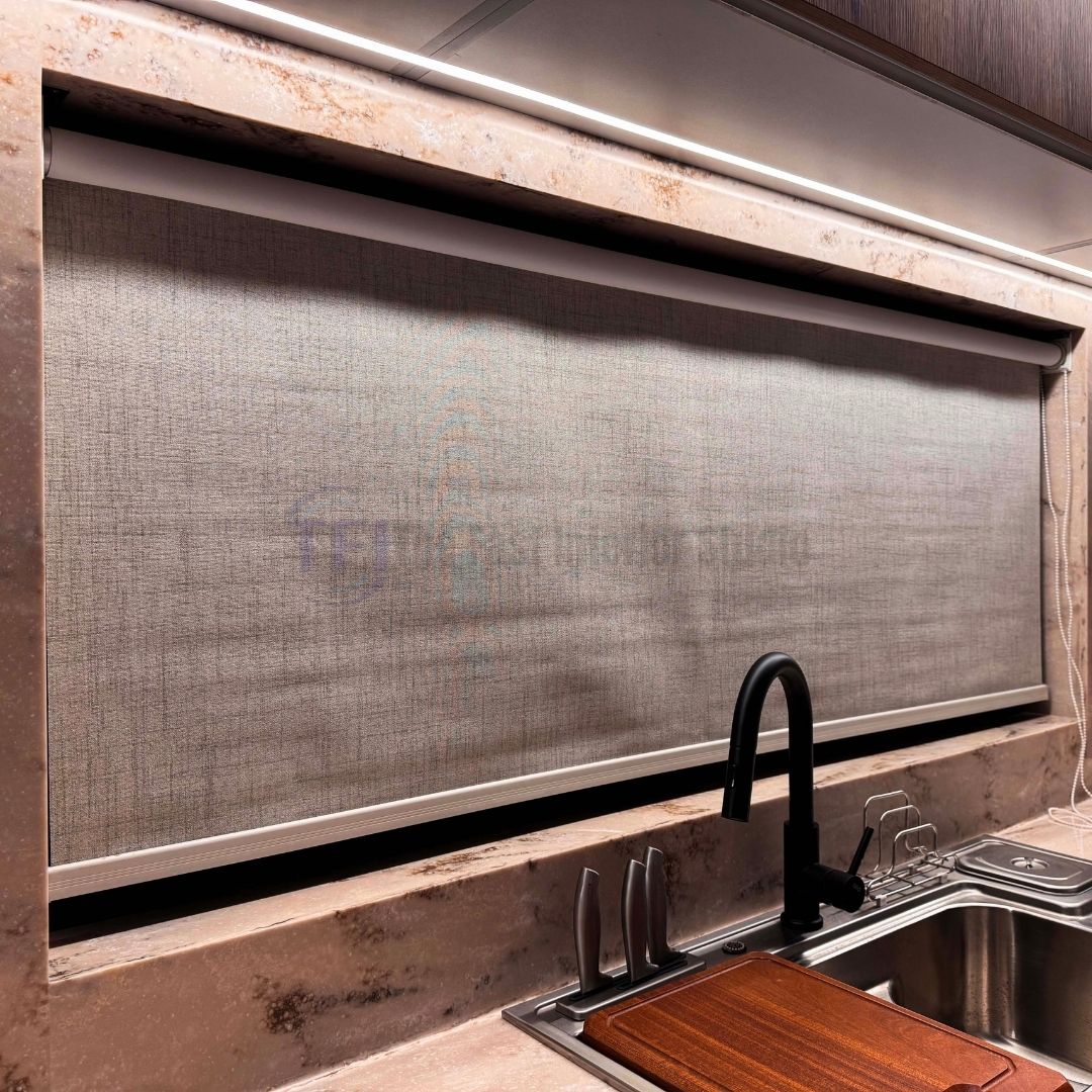 Close up of a premium textured kitchen roller blind installed above a sink
