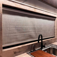 Close up of a premium textured kitchen roller blind installed above a sink