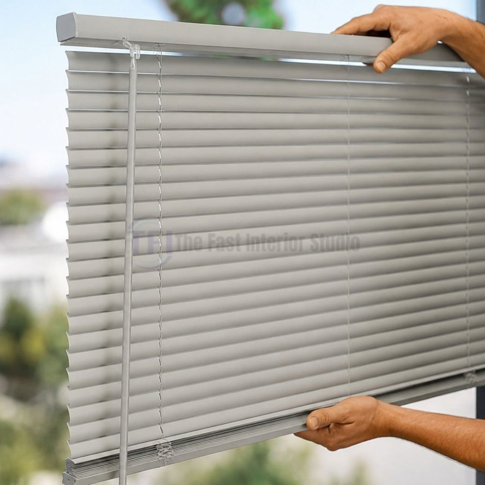 Close up of hands easily adjusting premium grey aluminum Venetian blinds