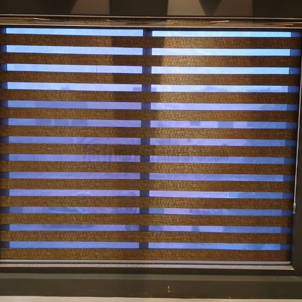 Close up of premium brown zebra blinds with alternating sheer and solid stripes in Islamabad