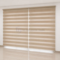 Custom fit warm beige dual layer Zebra window shades covering large glass doors above light tiled flooring