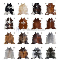 Extensive collection of natural genuine cowhide rugs in various colors including brown, black, grey, and brindle in Pakistan