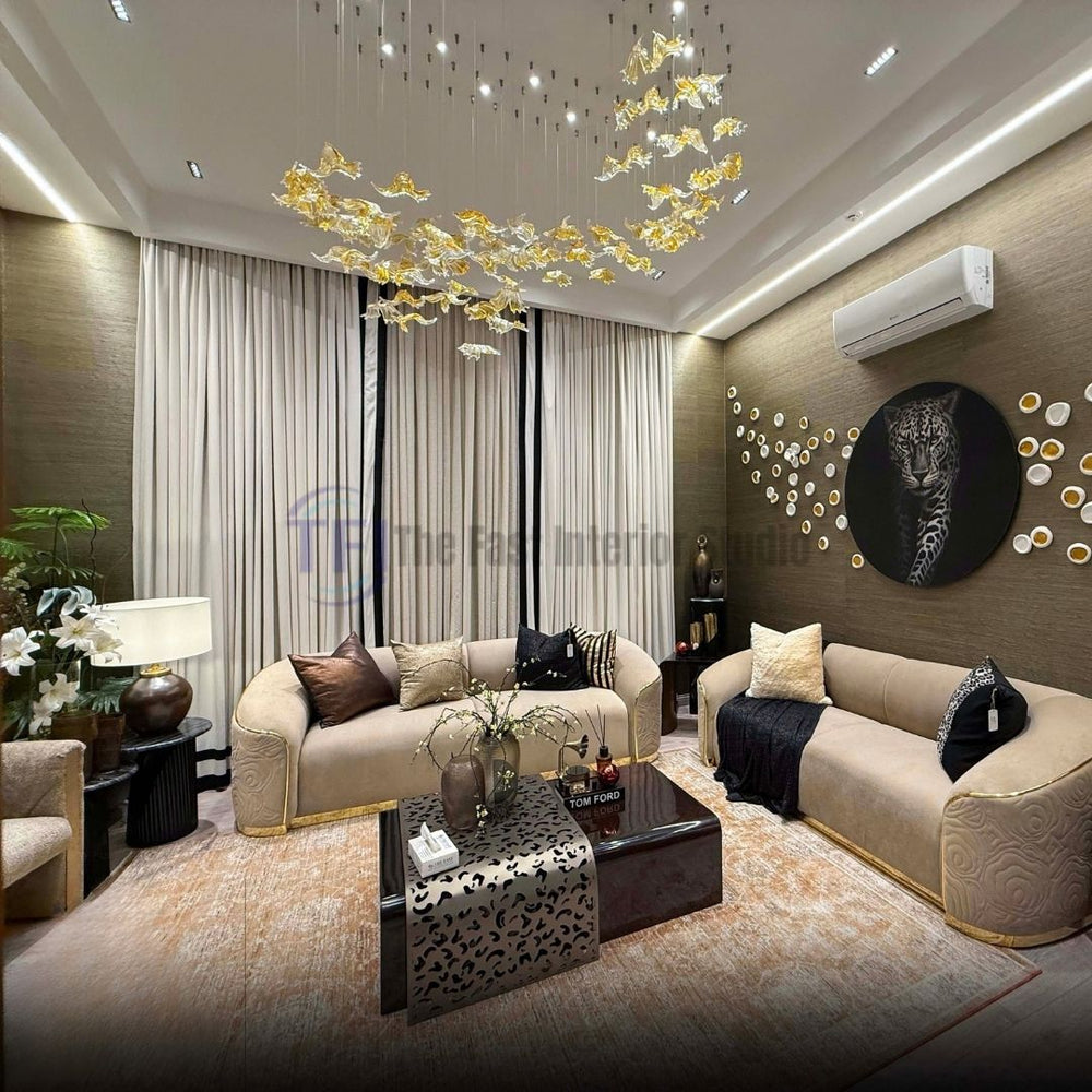 Front view of beige and black striped curtains behind curved beige sofas in a modern living space