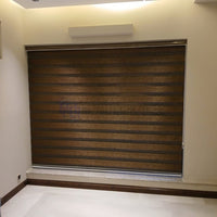 Large custom fit textured zebra window shades installed in a modern room