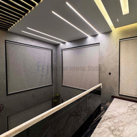 Large textured roller blinds installed in a modern hallway with high ceilings in Pakistan | The Fast Interior Studio