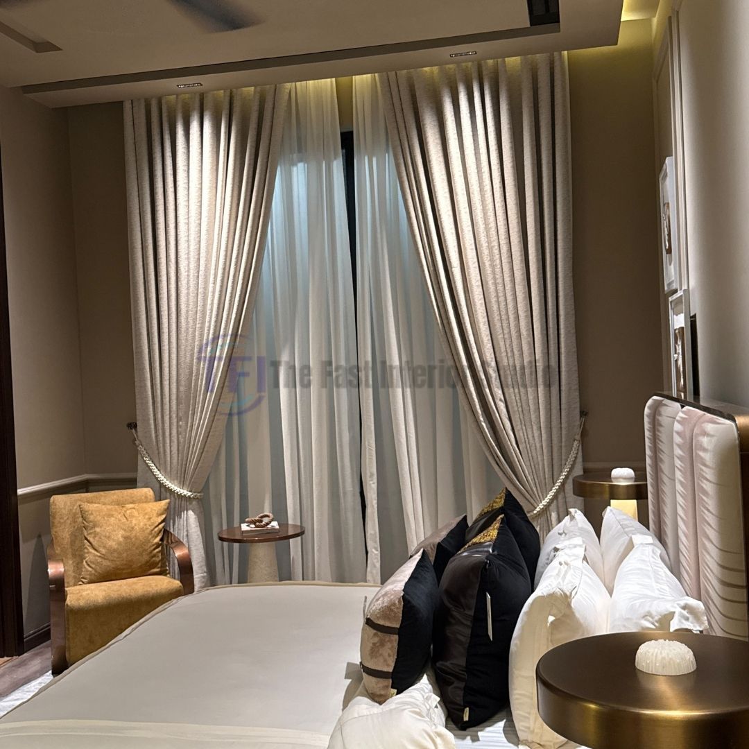 Layered beige and sheer white bedroom curtains with rope tie-backs
