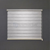 Modern grey Zebra blinds with smooth chain mechanism against a dark feature wall