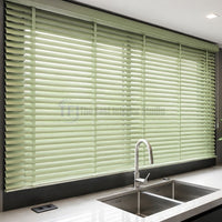 Moisture resistant sage green Venetian blinds over a modern kitchen sink