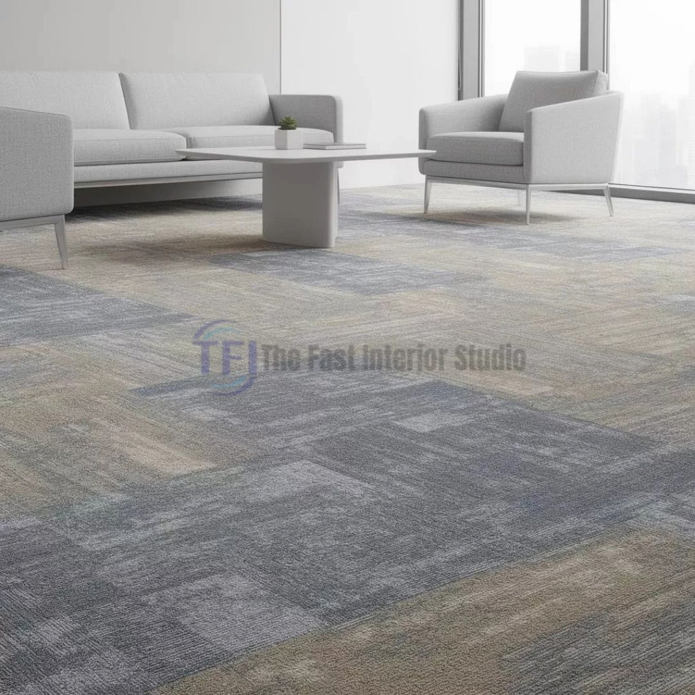 Multi-tone grey and beige patterned carpet tiles in a bright modern corporate reception or sitting area