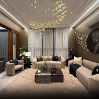 Pleated beige curtains with black trim in a luxury living room featuring a gold chandelier