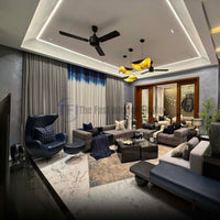 Pleated grey and blue ombre curtains in a modern living room with a blue leather armchair