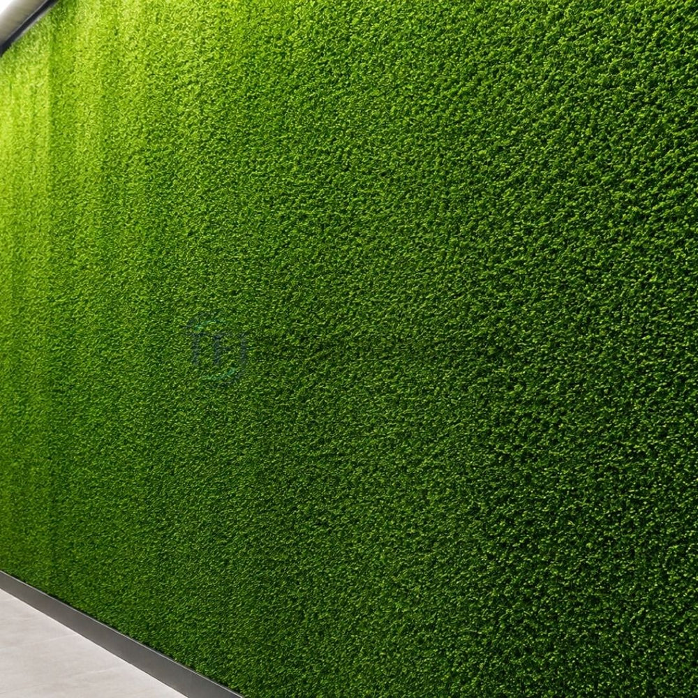 Premium artificial grass interior wall paneling with overhead lighting