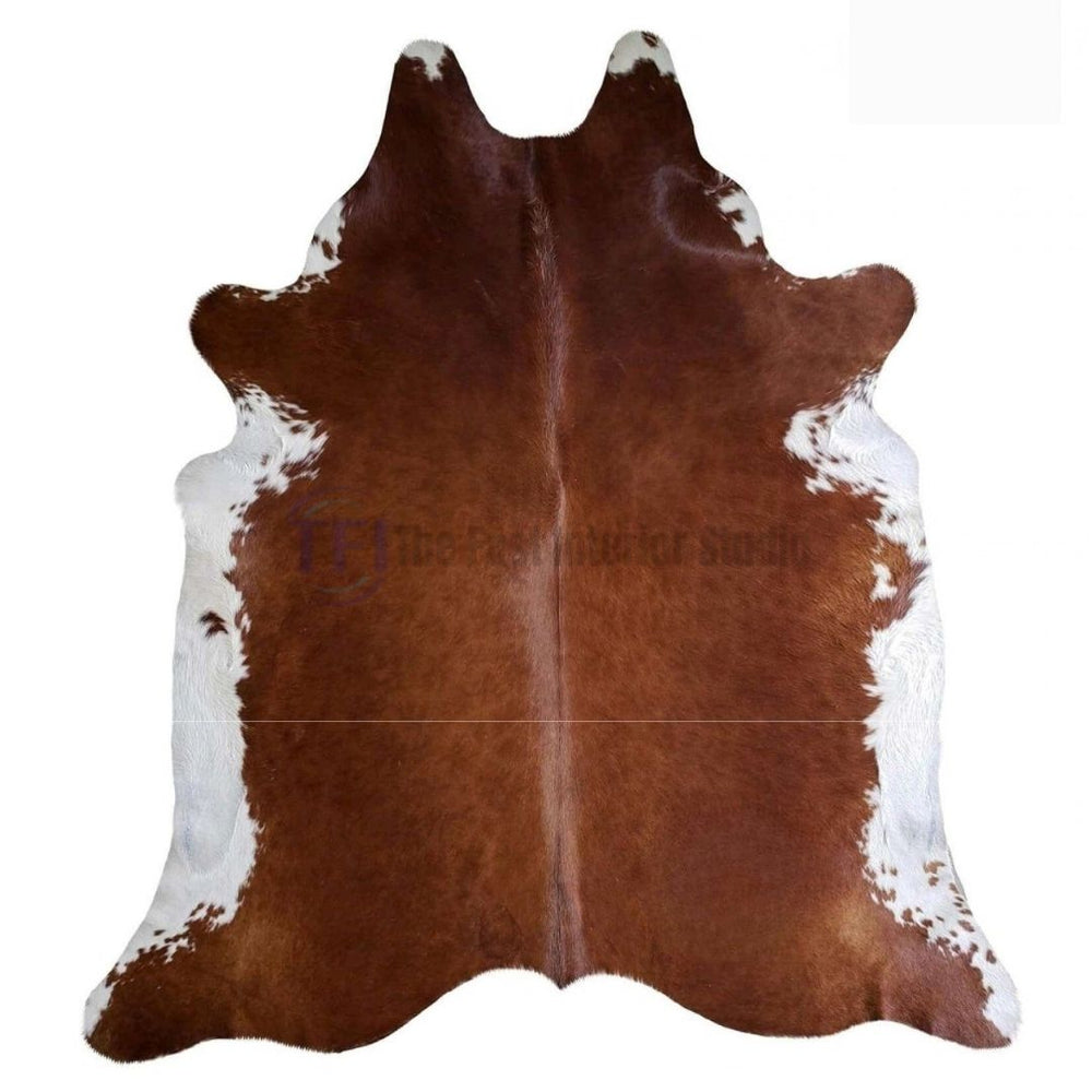 Premium authentic brown and white customized natural cowhide rug available at PKR 1,800 per square foot for modern home and office decor in Lahore | The Fast Interior Studio