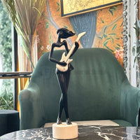 Premium modern female musician figurine styled for versatile home decor in Pakistan and worldwide