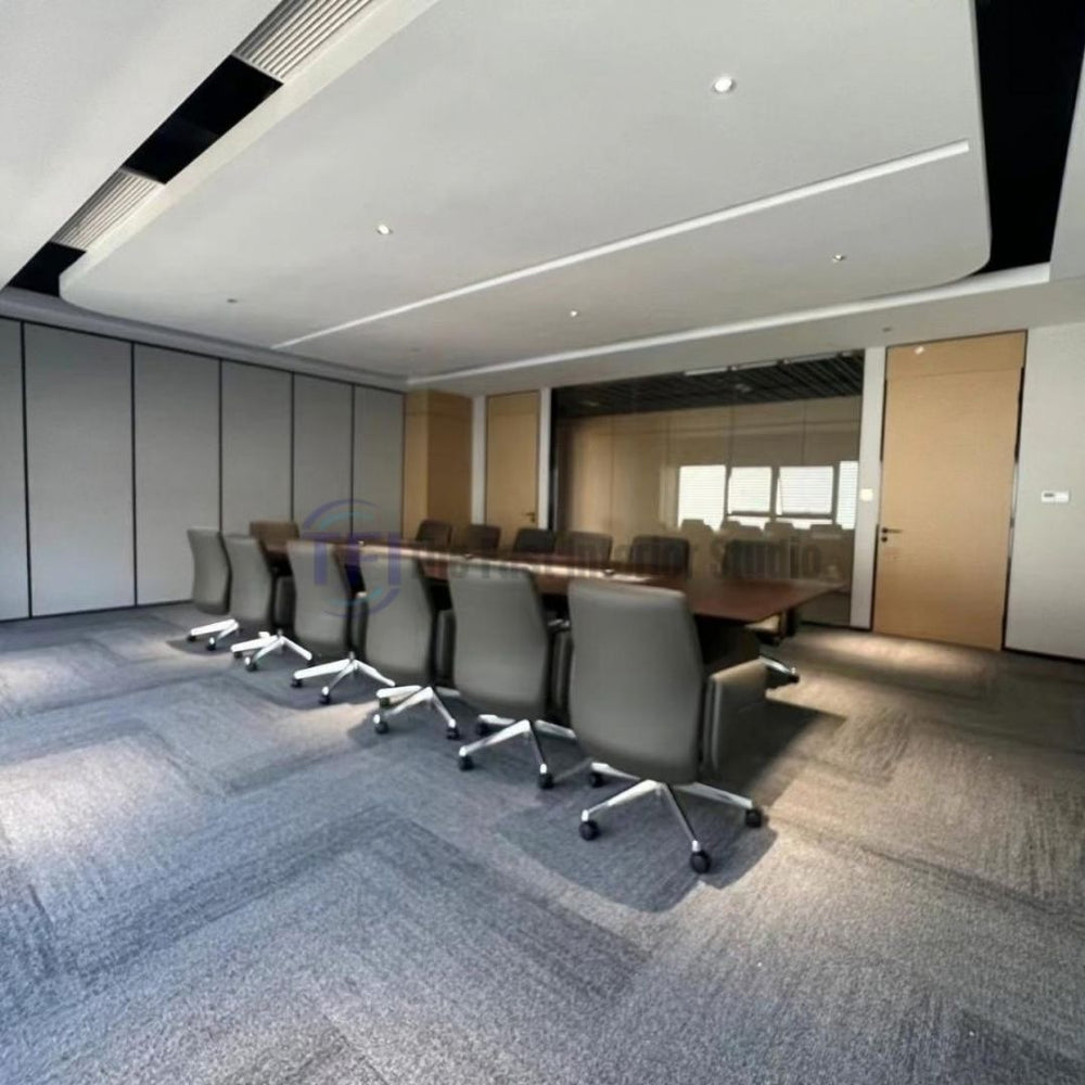 Professional grey modular carpet tiles installed in a sleek executive conference room in Lahore