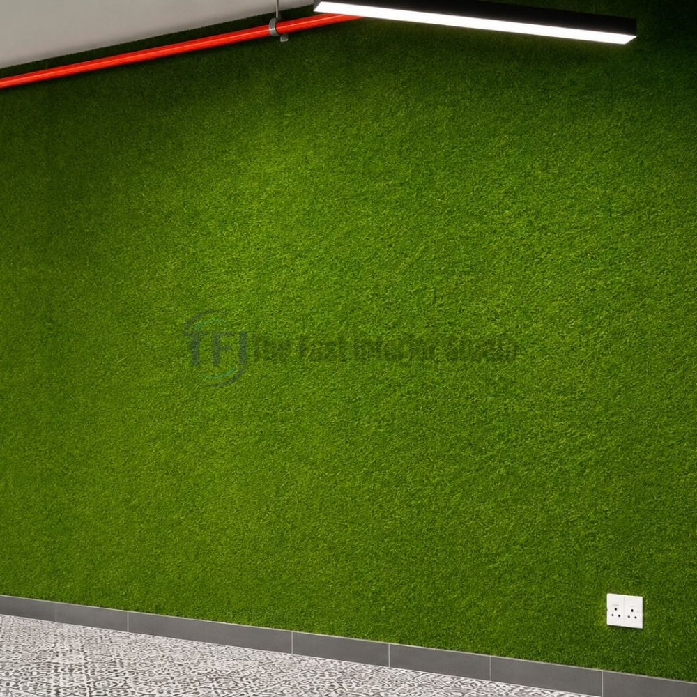 Seamless green artificial grass feature wall installed indoors