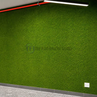 Seamless green artificial grass feature wall installed indoors