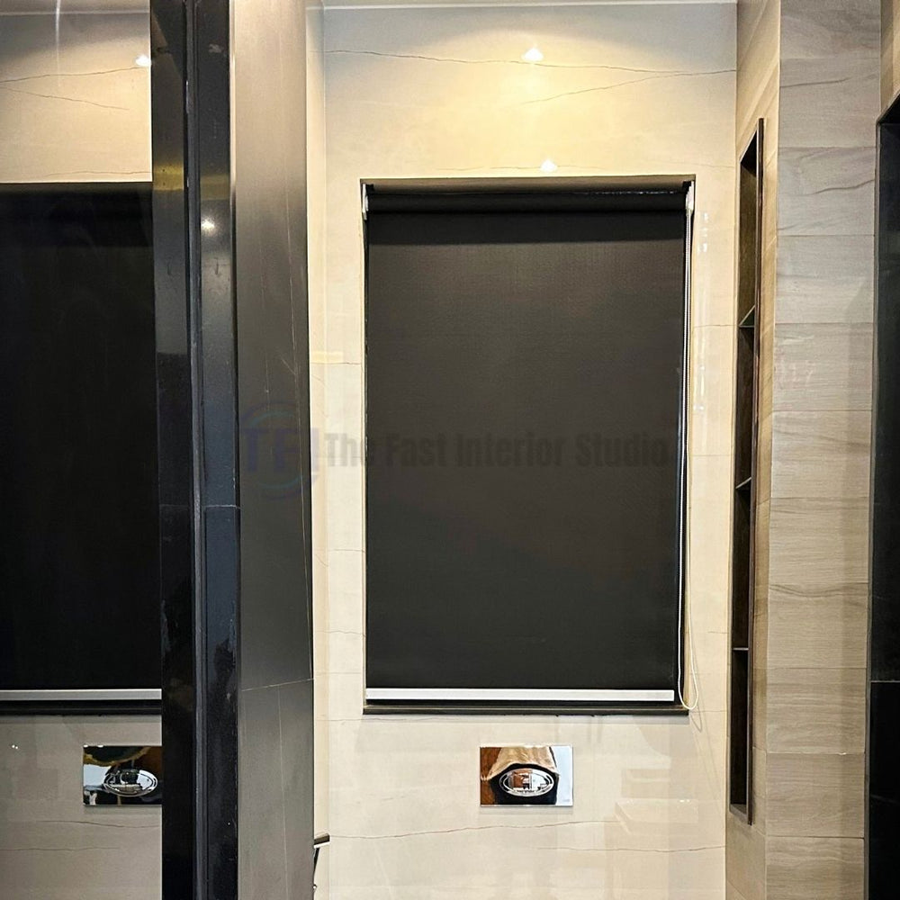 Sleek black roller blind installed in a modern tiled bathroom for complete window privacy