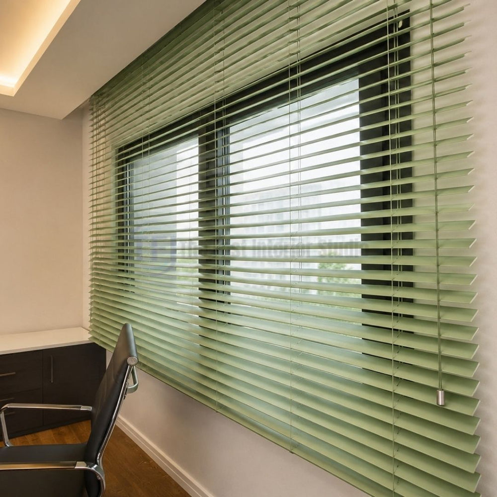 Sleek light green Venetian blinds installed in a modern home office