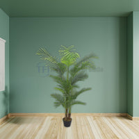 Tall 6-foot artificial palm plant in a small black pot positioned in a green room