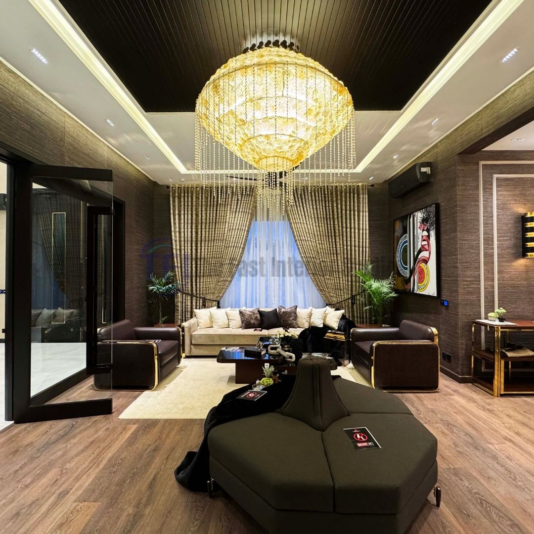 Textured gold curtains tied back in a grand formal living room with a crystal chandelier
