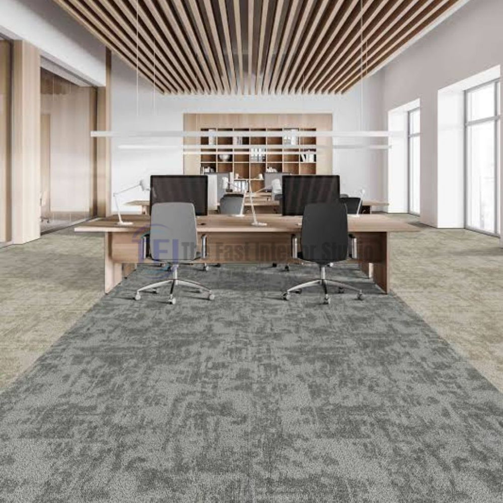 Textured grey carpet tiles installed in a modern open-plan office workspace featuring wooden slat ceilings in Lahore