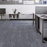 Textured grey carpet tiles installed under modern office workstations in Lahore | The Fast Interior Studio