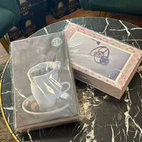 The best decorative faux coffee table books featuring coffee and luxury fashion designs, priced at 2750 each and styled on a marble table in Pakistan