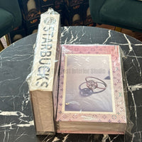Thick decorative prop books used for versatile coffee table styling in modern home interiors