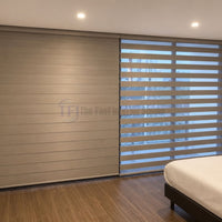 Trending dual layer zebra blinds installed in a modern bedroom for optimal light control
