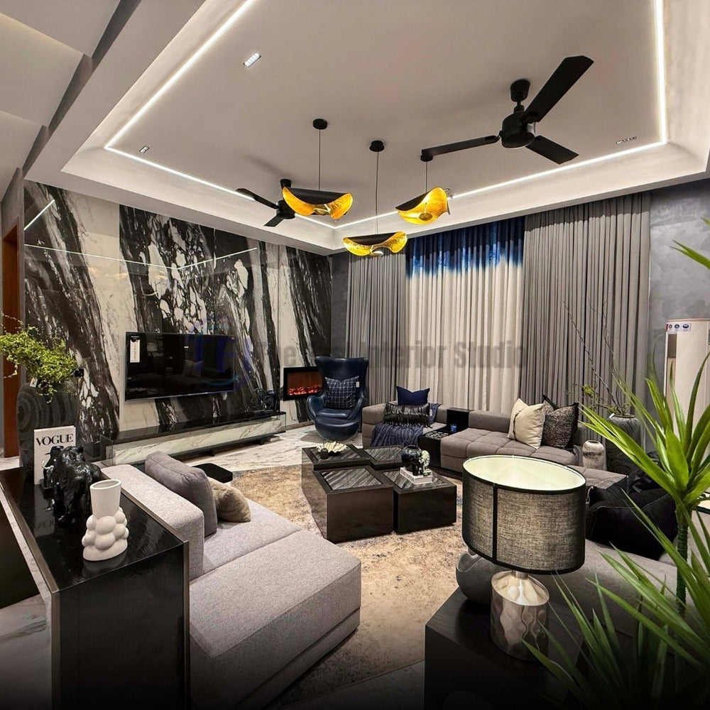 Wide view of a luxury living room featuring a marble accent wall and grey and blue curtains